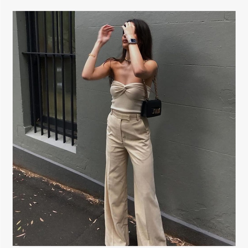Soft and stylish cream knotted tube top, size small. Excellent condition